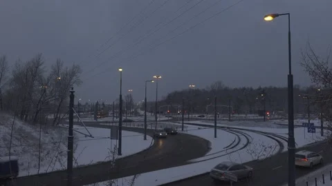 Snowy evening on roundabout Stock-Footage 148112817
