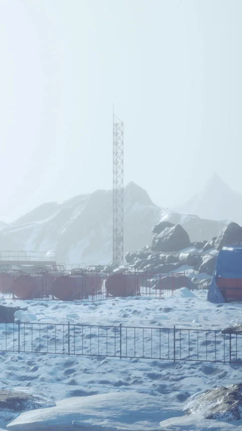 Snowy field and distant mountains at a research station Stock Footage 346758667