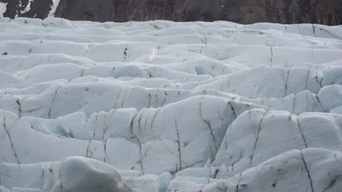 Snowy glacier near mountain slope Stock Footage