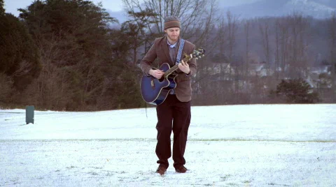Snowy Guitar Guy 5 Stock Footage 595932