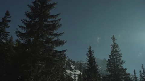 Snowy High Peaks Sun Flares Panning 4K Stock Footage 59776371