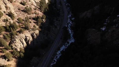Snowy Highway through Rocky Mountain Canyon in Boulder Colorado Stock Footage 296465302