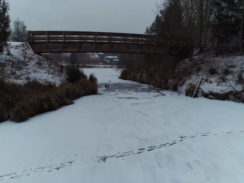 Snowy Lake Going Under Bridge Stock Footage 72965440
