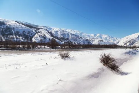 Snowy landscape from the train window Stock Photos