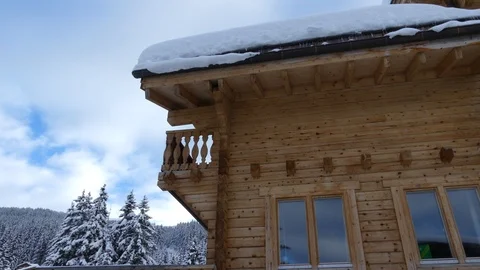 SNOWY LODGE WITH SKY BACKGROUND Stock Footage 121485030