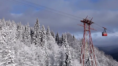 Snowy mountain and red cable car in Sinaia Stock Footage 103530149