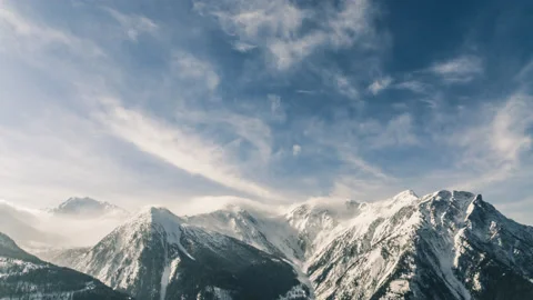 Snowy Mountain with beautiful Clouds Timelapse (4K) Stock Footage 147380255