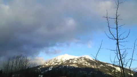 Snowy mountain cloud timelaps Stock Footage 14898885