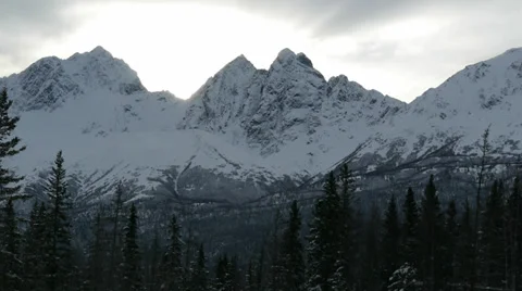 Snowy Mountain, Grey Sky, Trees, Hidden Sun Stock Footage 38059805
