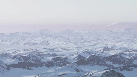Snowy mountain landscape at dusk with distant peaks seen in the background Stock Footage 344551944