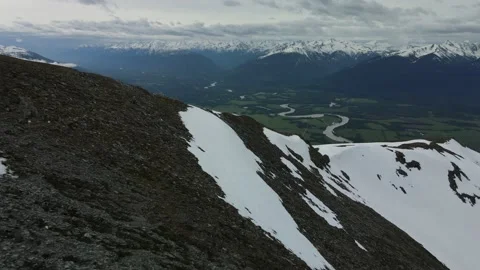 Snowy Mountain Landscape with Valley below, Aerial Drone Stock Footage 169558490