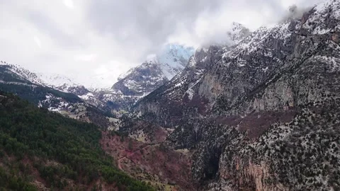 Snowy Mountain Peak and Deep Valley – 4K Aerial Drone Footage Stock Footage 331714294