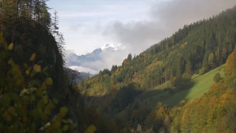 Snowy mountain peaks view through the forest hills Video stock 81436845