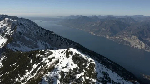 Snowy mountain peeks overlooking Lake Garda, Italy Stock Footage 102498702
