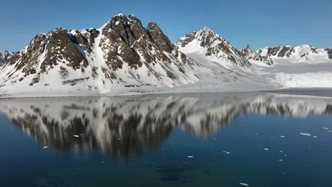 Snowy Mountain Range Aerial View 4k Glacier Reflection Stock Footage 338264848