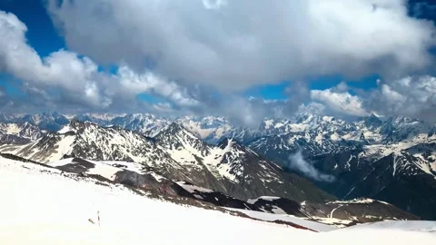Snowy mountain range covered by drifting clouds Stock Footage 340962955