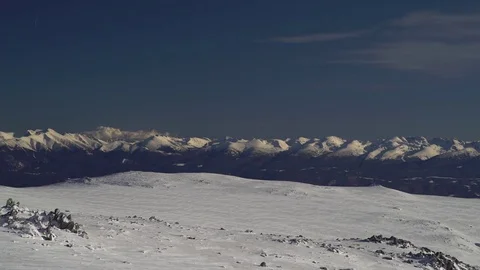 Snowy Mountain Range in the Distance in Winter Sun 4K Video stock 76517256