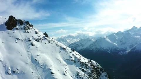Snowy Mountain Range on a Sunny Day Stock Footage 320855770