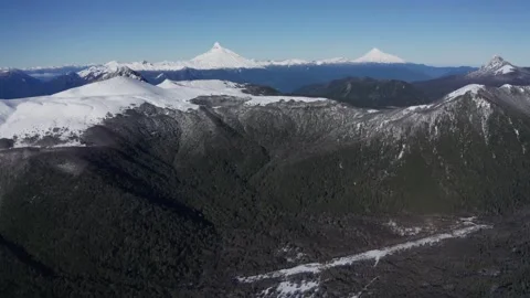 Snowy Mountain Range with Volcanic Peaks Stock Footage 303603897