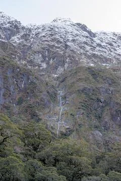 Snowy mountain range with Waterfall Stock Photos