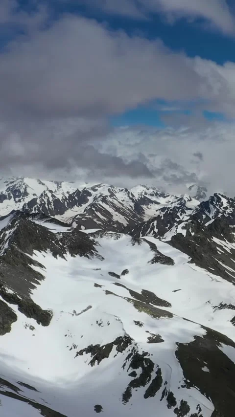 Snowy Mountain Range in a Winter Scene Stock Footage 288014543