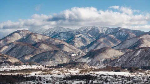 Snowy Mountain Ridges Above Hakuba Village Japan, Winter Daytime Timelapse Stock Footage 344909189