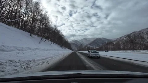 Snowy Mountain Road with Rest Area Truck and Traffic Hokkaido Stock Footage 333369733