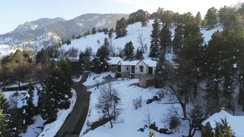 Snowy mountain with Spring trees - Drone camera moves down Stock Footage 137954968