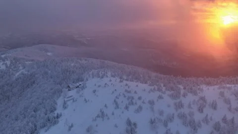 Snowy Mountain Summit Sunset Orbit Hut Stock Footage 336278105