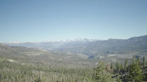 Snowy mountain trees handheld slomo wide 4k Video stock 314925344