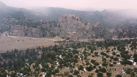 Snowy Mountain Valley Pan Down Drone Shot 4K Stock Footage 100346108