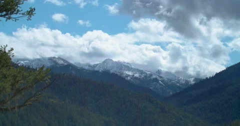 Snowy Mountains Alpine Forest clouds moving Stock Footage 162789097