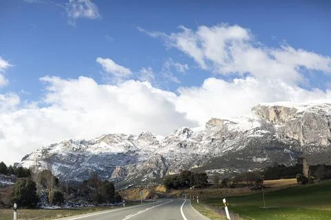 Snowy mountains and clouds Stock Photos