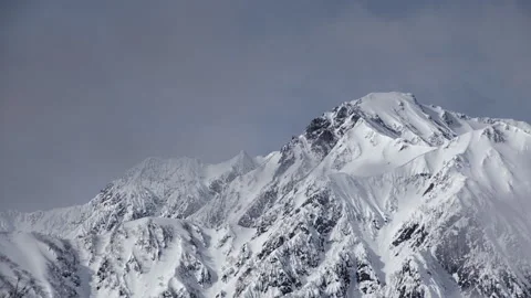 Snowy Mountains and Clouds: A Time-Lapse of Morning Mist in a Winter Landscape Stock Footage 333134028