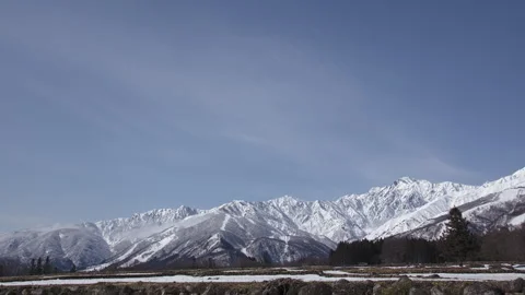 Snowy Mountains and Clouds: A Time-Lapse of Morning Mist in a Winter Landscape Stock Footage 333134477