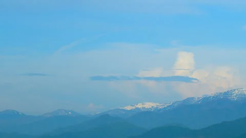 Snowy Mountains And Hills. Shadow Of Clouds Creating Patterns. Spruce Forest In 動画素材 256834073