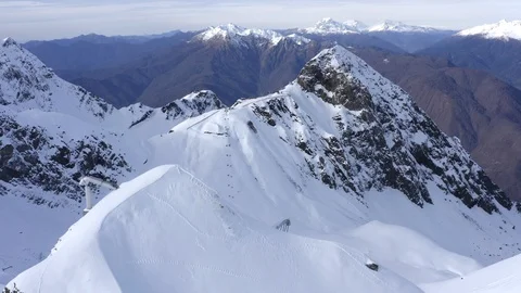 Snowy mountains and ski elevator for transportation at ski resort drone view Stock Footage 100111323