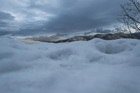 Snowy mountains and sky Stock Photos