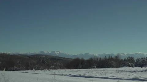 Snowy Mountains and Sun Panning Stock Footage 59771847