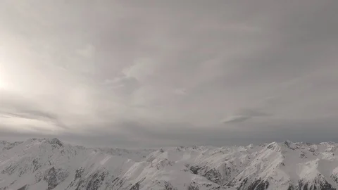 Snowy mountains clouds time lapse shot flat raw for post color grading. Ischgl.  Stock Footage 85124910