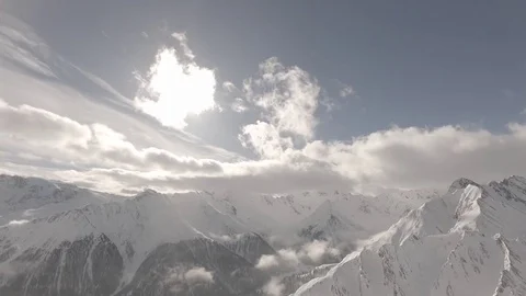 Snowy mountains clouds time lapse shot flat raw for post color grading. Samnau Stock Footage 85428889