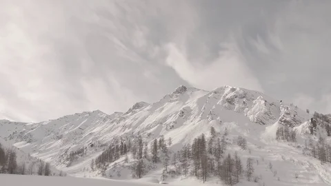 Snowy mountains clouds time lapse shot flat raw for post color grading. Samnau Stock Footage 85431066