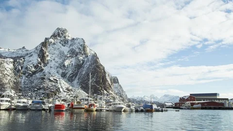 Snowy mountains with cloudy sky background with port during day time in Finland Stock Footage 121574176