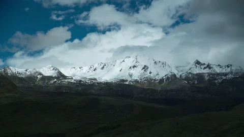 Snowy mountains in cloudy weather2 Stock Footage 83765341