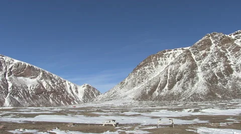Snowy mountains in a cold scenery. Stock Footage 68978236