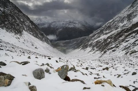 Snowy mountains with dramatic snowstorm sky in the Alps, Switzerland Stock Photos