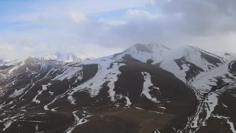 Snowy mountains drone shot Video stock 240120457