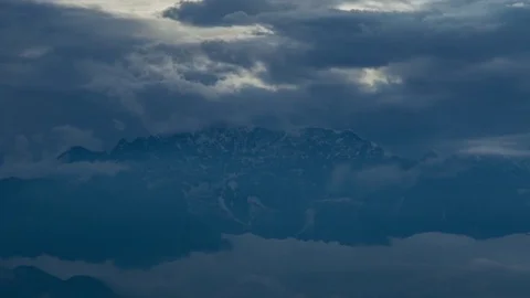Snowy mountains inside the clouds Stock Footage 83793578
