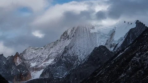 Snowy mountains in the mist Stock Footage 83873665