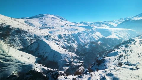 Snowy mountains roads pine forests and magnificent scenery 動画素材 294217399